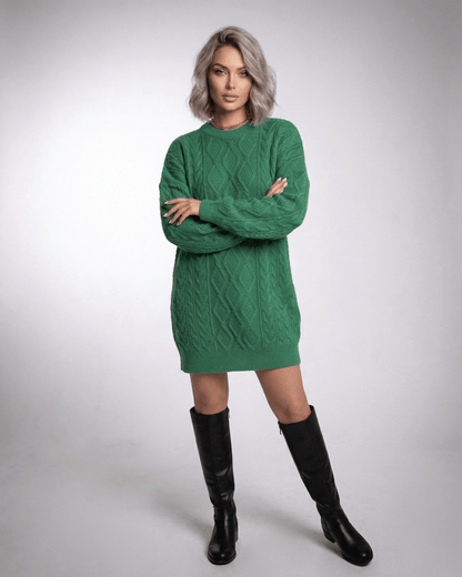 Model wearing Ivy Mini Dress in Emerald Green Cable Knit by Lauven, showcasing a loose fit and ribbed trims.