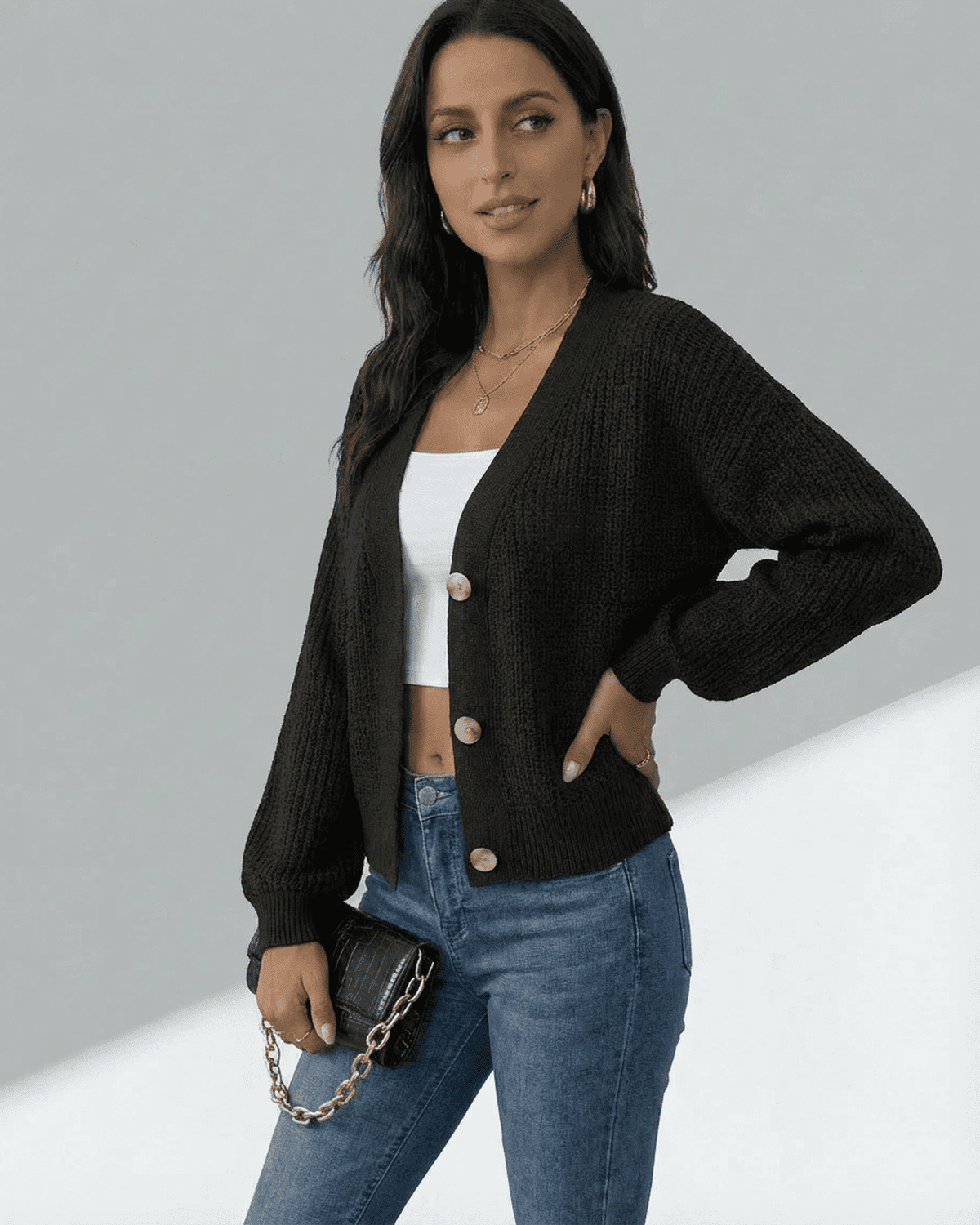 Orion Cardigan by SLIMONA, featuring a stylish black design with long sleeves and button front, perfect for layering.