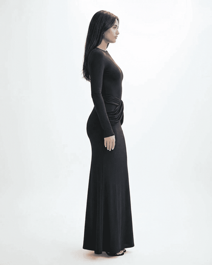 Orion Maxi Dress by SLIMONA, showcasing a side view of a long sleeve black dress with ruched detail.