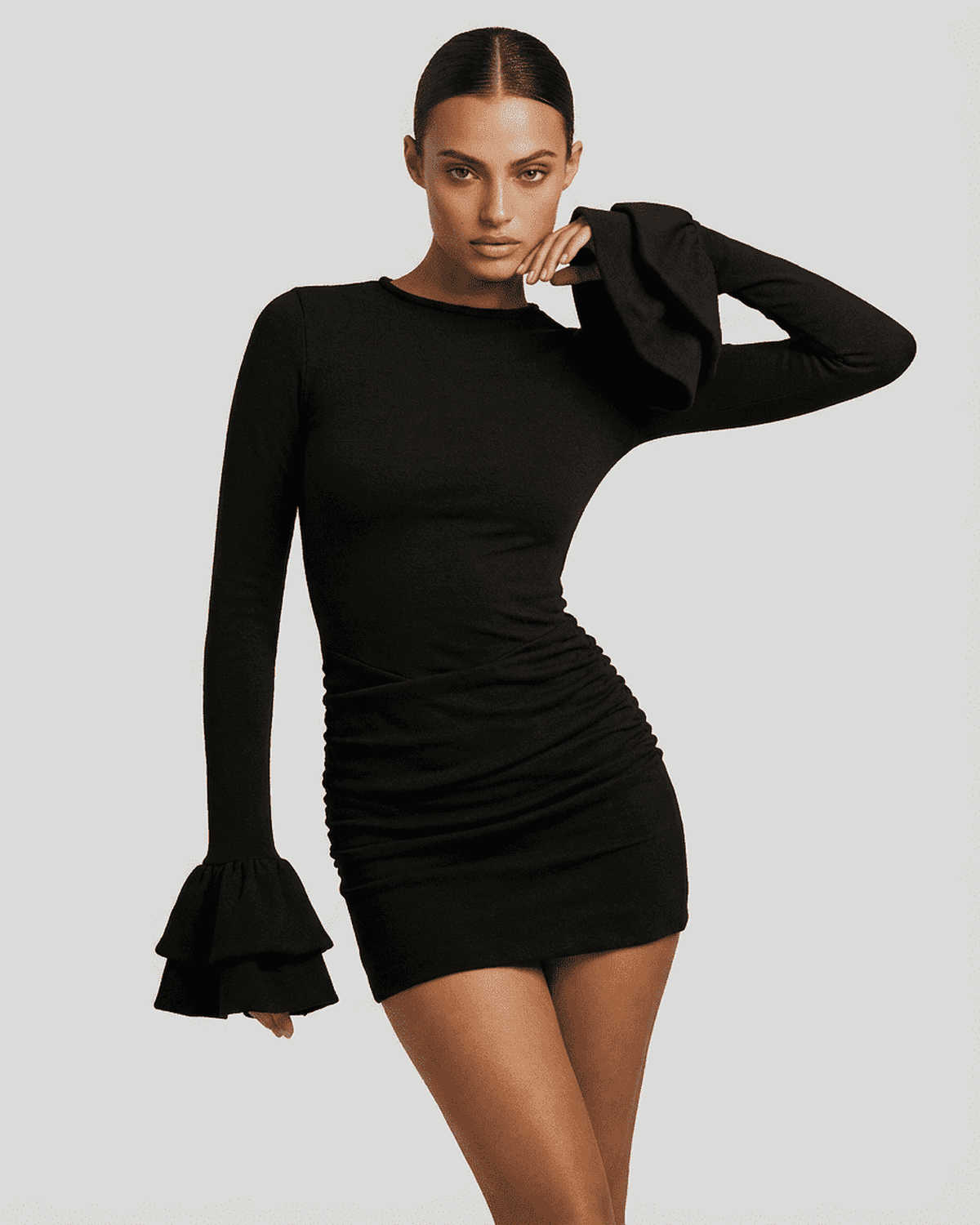 Orion Mini Dress by SLIMONA – Elegant black bodycon dress with ruffled sleeves and ruched sides.