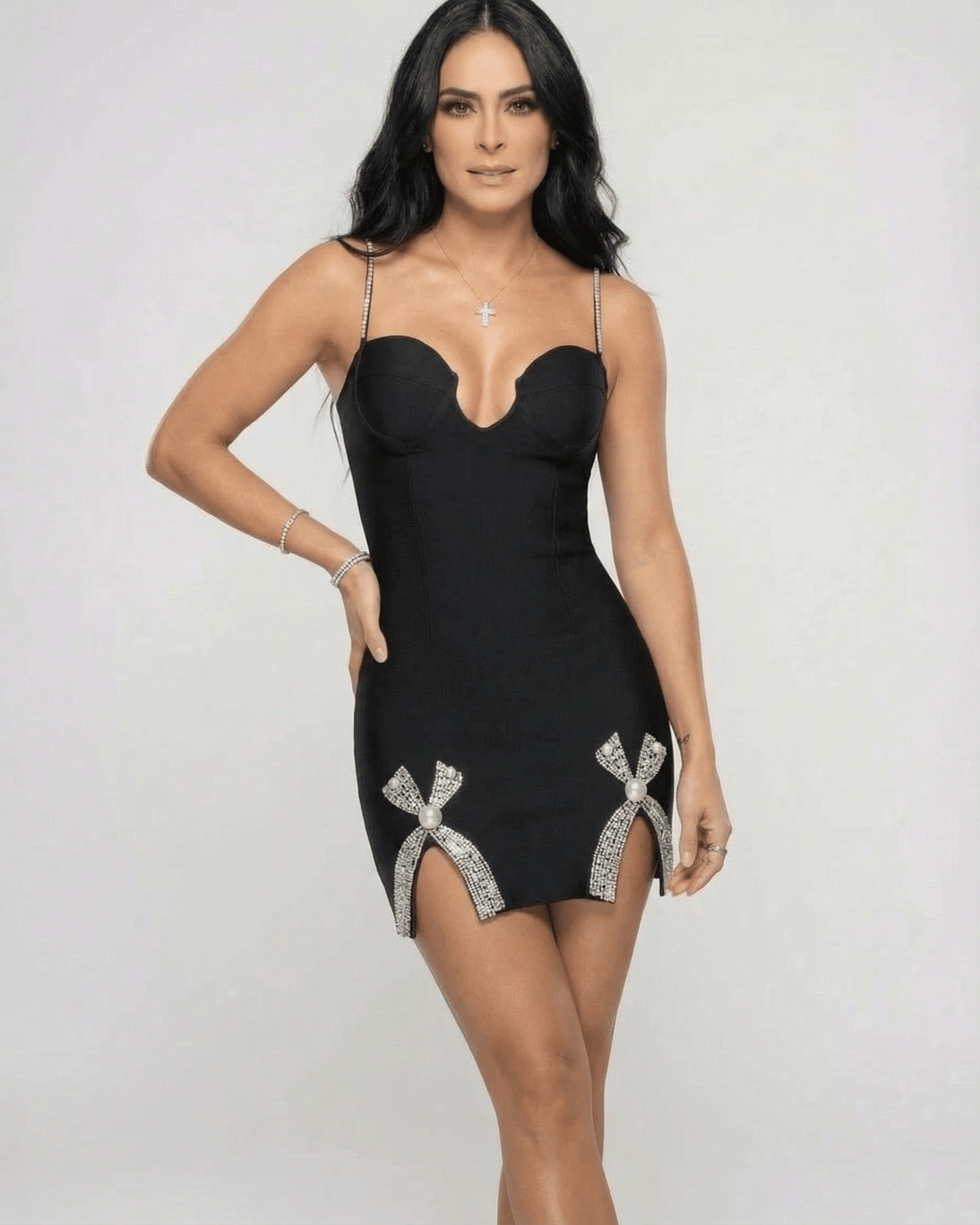 Orion Mini Dress by Lauven featuring a V-neck sheath silhouette with crystal-style embellished slits in black.
