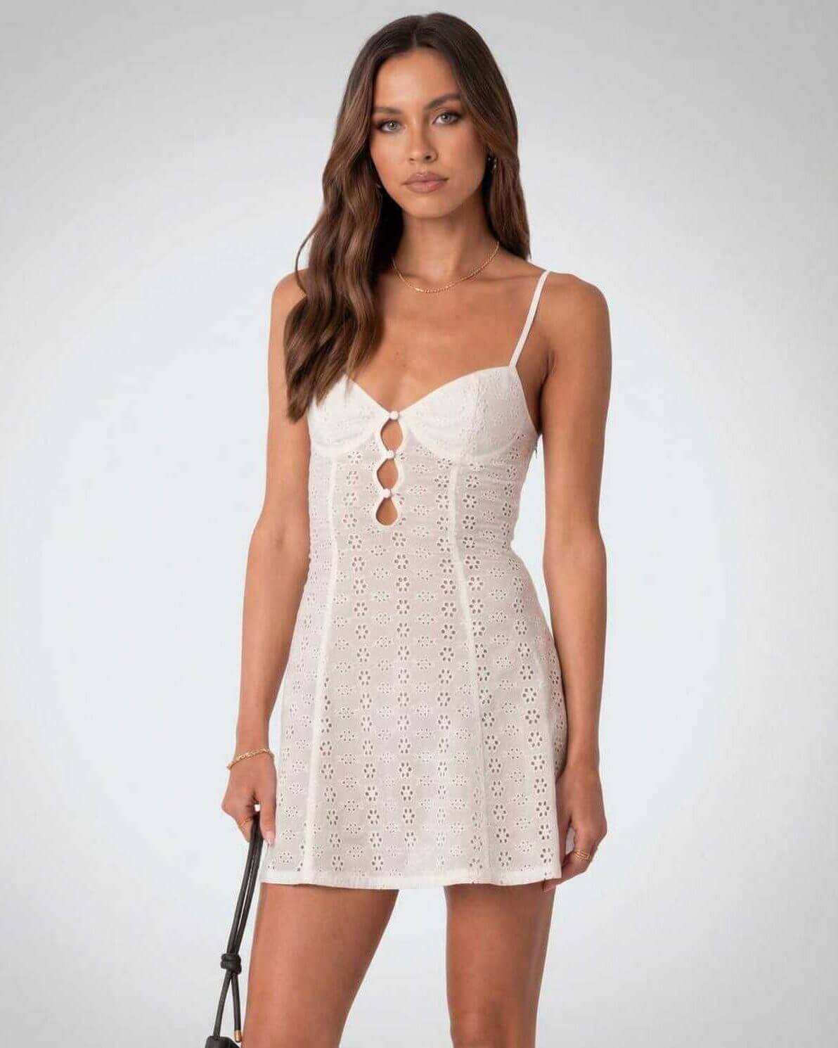 Luna Mini Dress by Lauven, elegant A-line design with spaghetti straps and hollow out detail.
