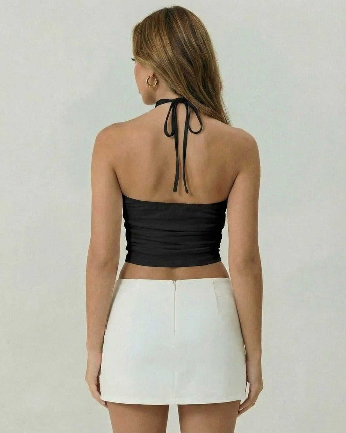 Back view of the Lauven Monaco Top, a black strapless tank top with ruched detail and halter tie.