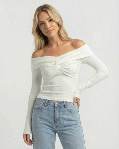 Monaco Top by Lauven – Women’s off the shoulder long sleeve white top in ribbed knit with twist-front detail.
