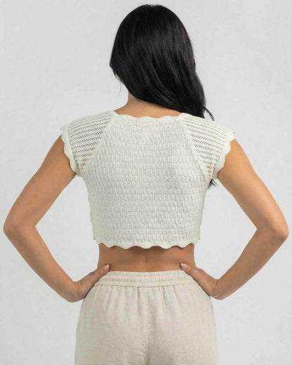 Back view of the Calista Top by Lauven, showcasing its unique lettuce trim design and comfortable fit.