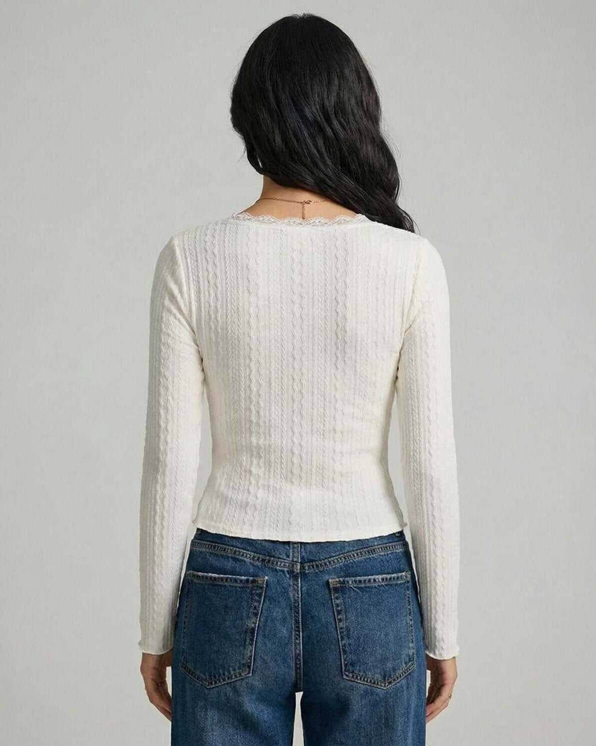 Back view of the Sienna Pullover by Lauven, featuring a fitted design and elegant ribbed texture.