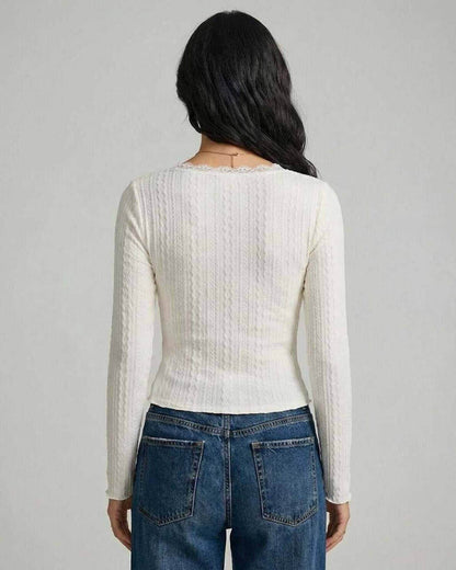 Back view of the Sienna Pullover by Lauven, featuring a fitted design and elegant ribbed texture.