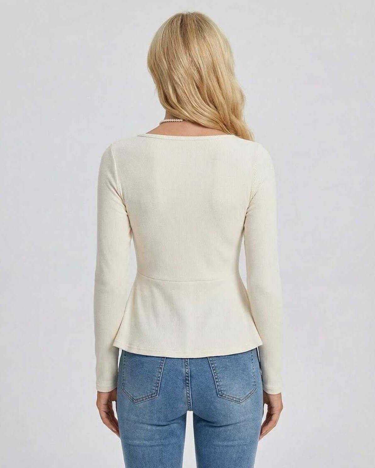 Women’s back view of Lauven Monaco Pullover with long sleeves and peplum detail in soft ribbed knit.