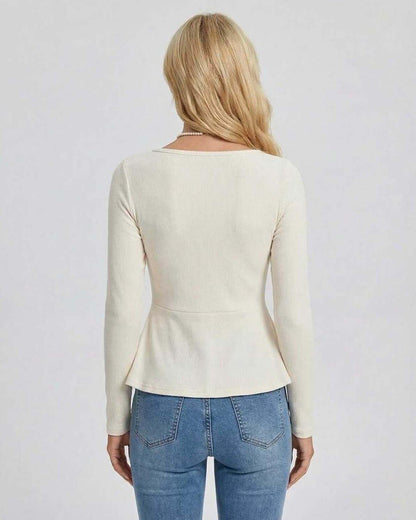 Women’s back view of Lauven Monaco Pullover with long sleeves and peplum detail in soft ribbed knit.