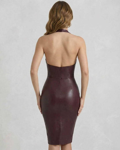 Back view of a woman wearing the Vega Midi Dress by Lauven in burgundy faux leather with a laced halter neckline.