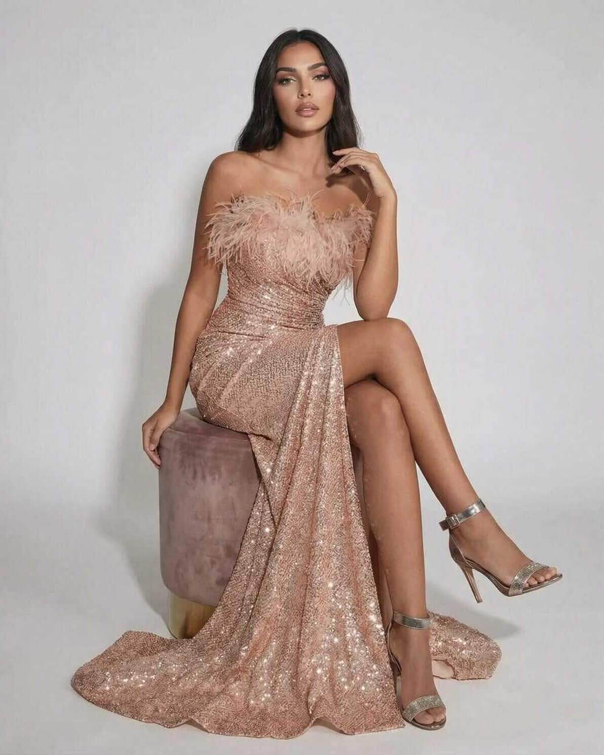 Blush Maxi Dress by Lauven, luxurious blush sequin evening gown with feather detail, off the shoulder neckline, stunning silhouette.
