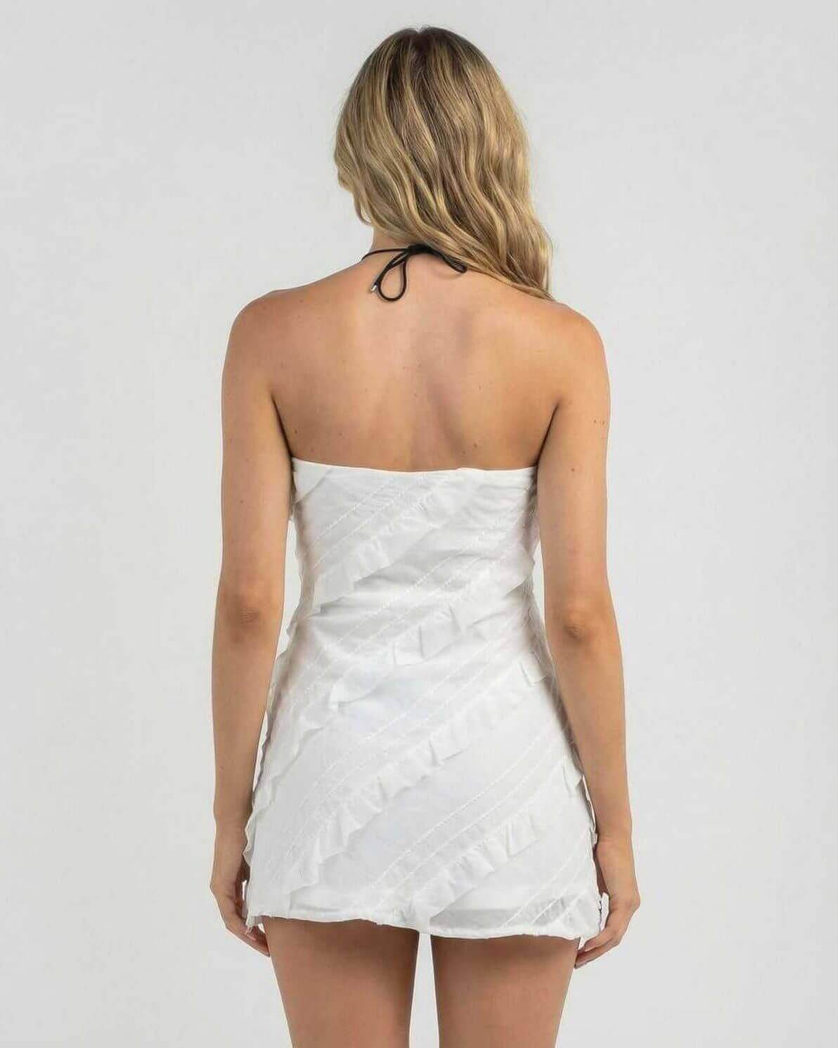 Isla Mini Dress by Lauven, elegant strapless sheath dress with delicate ruffle details, back view.