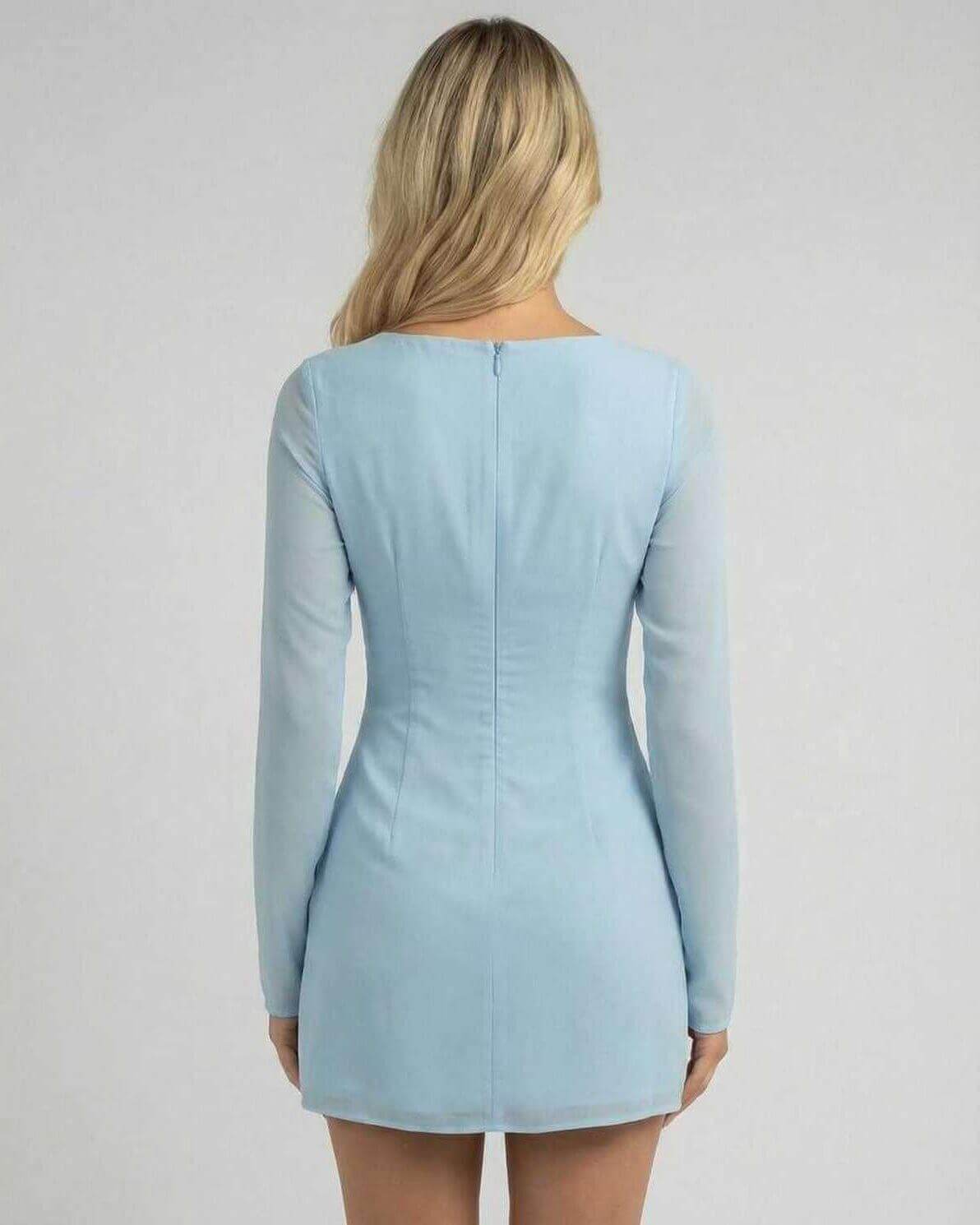 Celeste Mini Dress by Lauven in soft blue, showcasing a sleek silhouette and elegant long sleeves from the back.