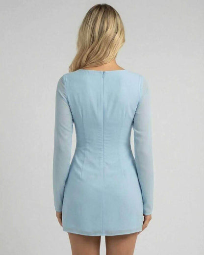 Celeste Mini Dress by Lauven in soft blue, showcasing a sleek silhouette and elegant long sleeves from the back.