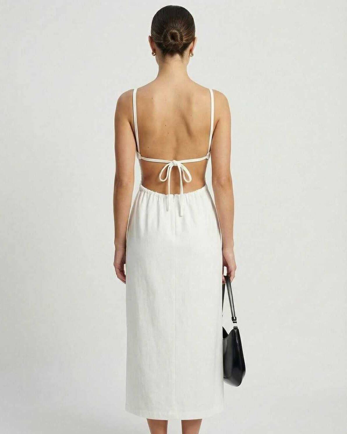 Celeste Midi Dress by Lauven featuring a backless strappy design and ruched details, perfect for elegant occasions.