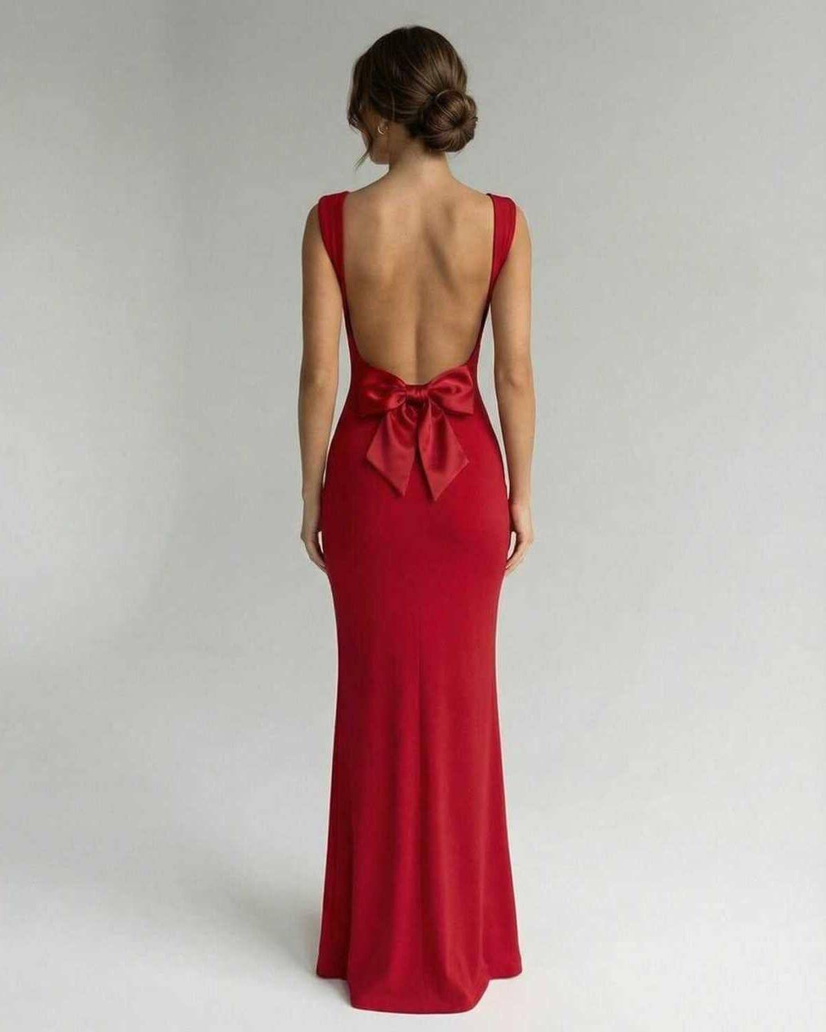 Scarlet Maxi Dress by Lauven, showcasing a sleek design with a stylish back and bow detail in vibrant red.