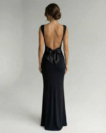 Obsidian Maxi Dress by Lauven, featuring a sleek back design with a bow detail, perfect for elegant occasions.