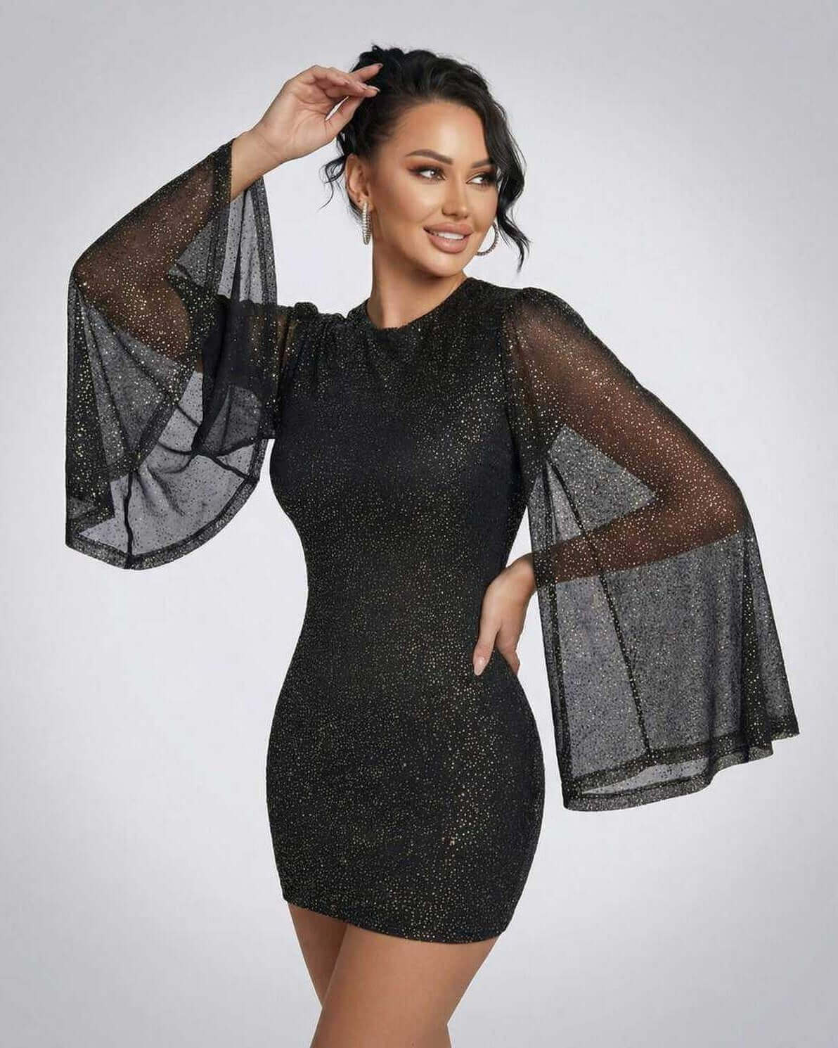Celeste Mini Dress by Lauven, featuring sheer cloak sleeves and a sparkling dot pattern for an elegant look.