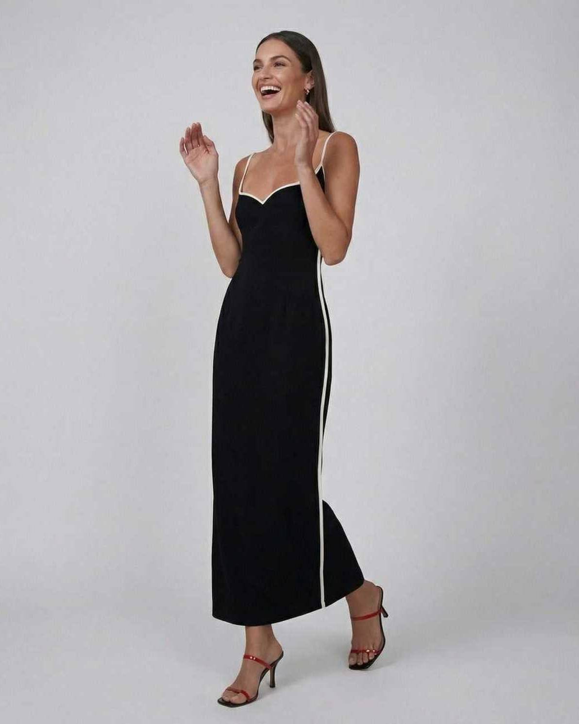 Orion Midi Dress by Lauven, sleek black dress with contrast piping, featuring a flattering slim fit silhouette.