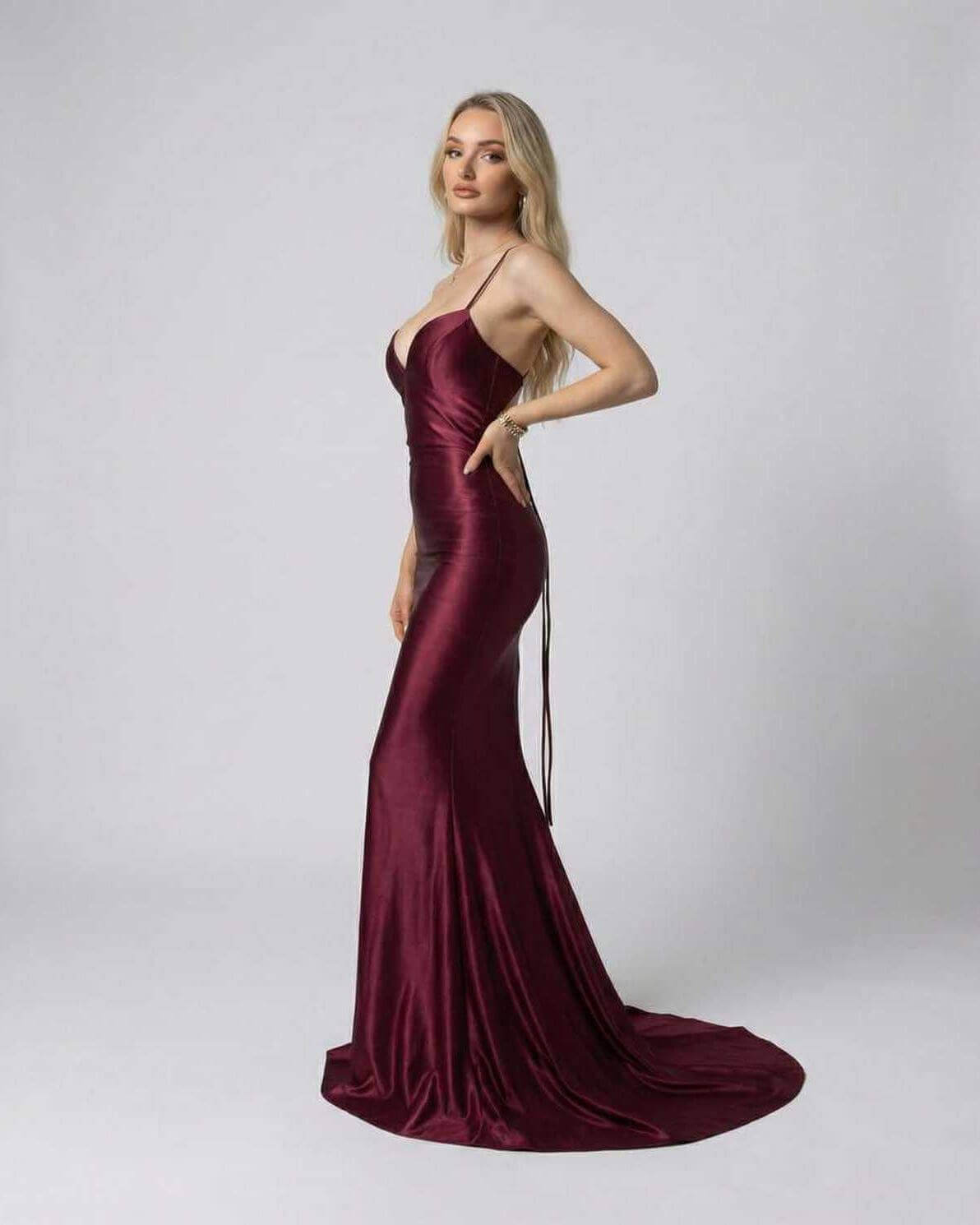 Marcelline Maxi Dress by Lauven in luxurious burgundy satin with slim fit silhouette and spaghetti straps.