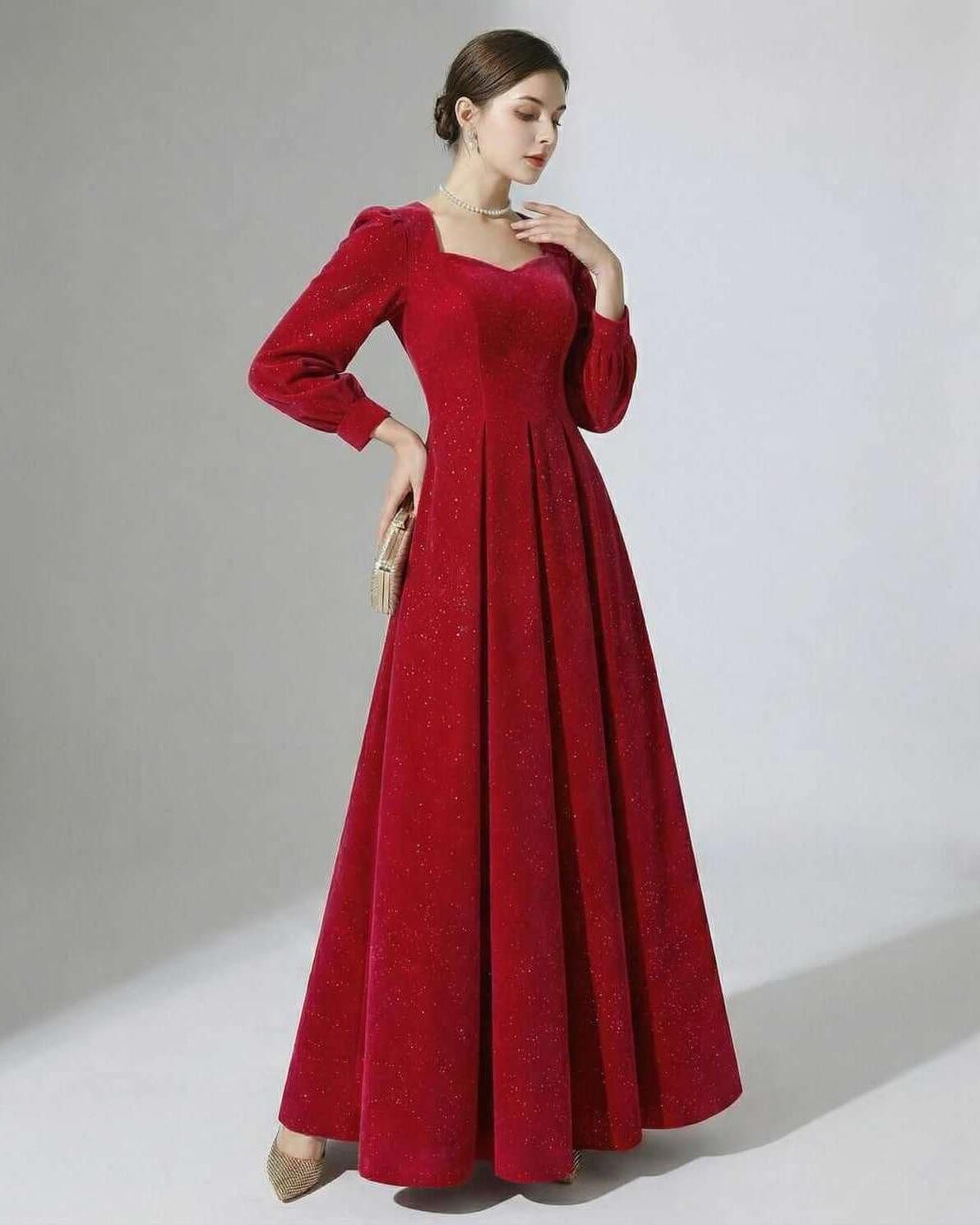 Celeste Maxi Dress by Lauven, elegant red A-line velvet gown with puff sleeves and subtle glitter accents.
