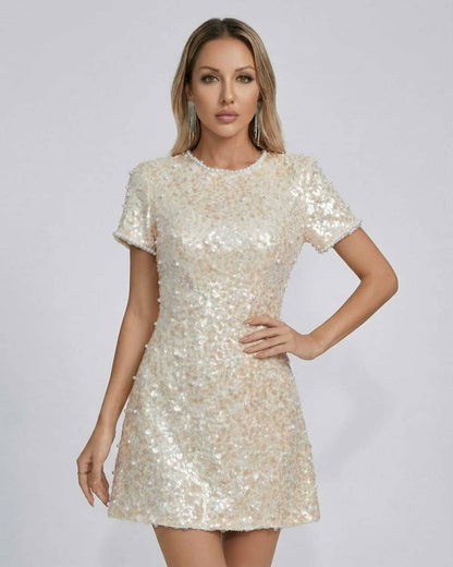 Luna Mini Dress by Lauven, featuring elegant sequin embellishments and a sophisticated soft beige tone.