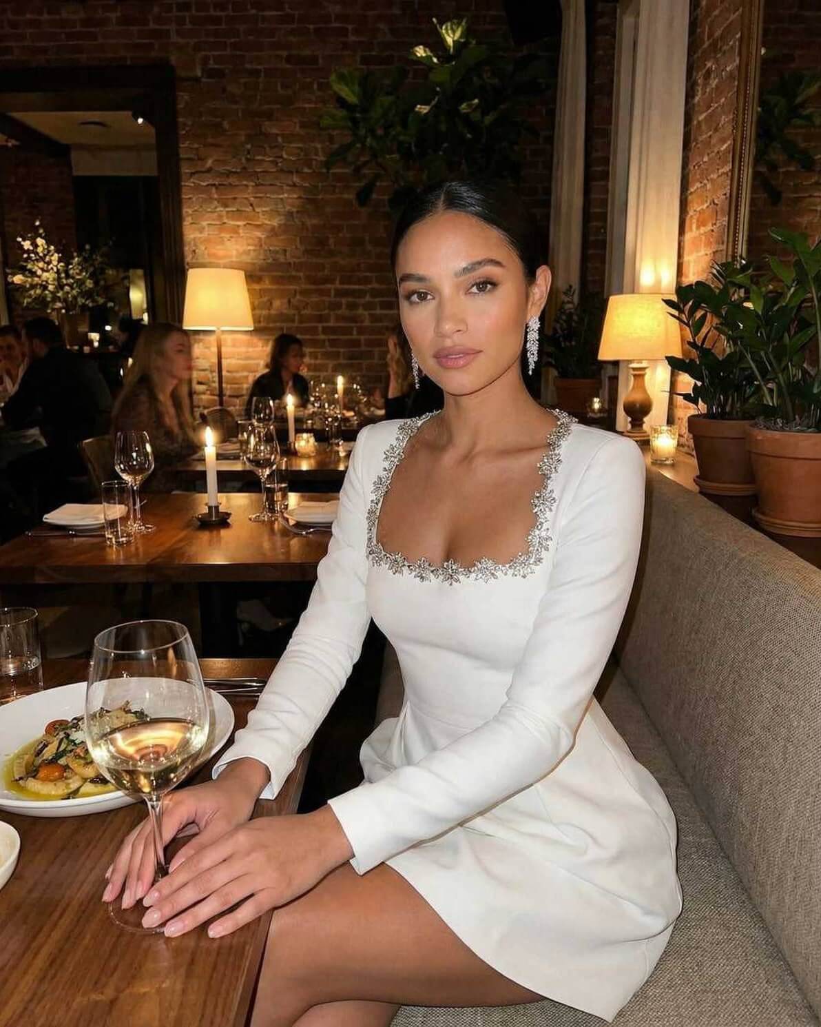 Serena Mini Dress by Lauven, featuring elegant square collar and A-line silhouette, worn at a classy dinner setting.