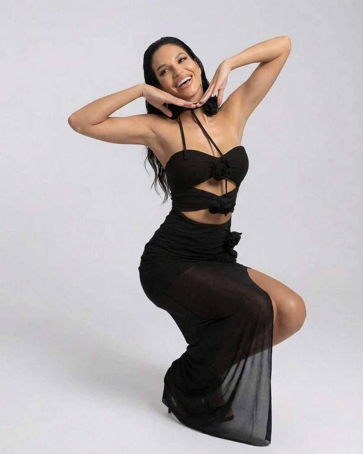 Nerina Maxi Dress by Lauven, elegant black halter neck dress with cutout silhouette and high stretch fabric.