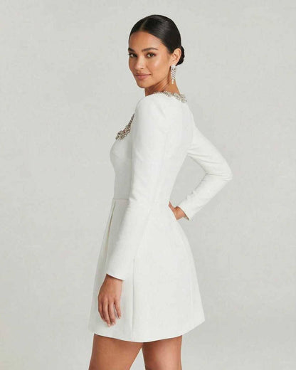 Serena Mini Dress by Lauven featuring elegant square collar and A-line silhouette, modeled by a woman in white.
