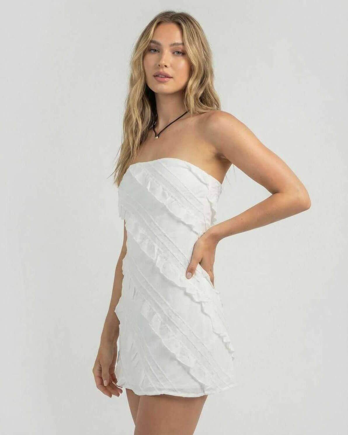 Isla Mini Dress by Lauven, featuring a strapless style with delicate ruffle details in white, perfect for modern elegance.