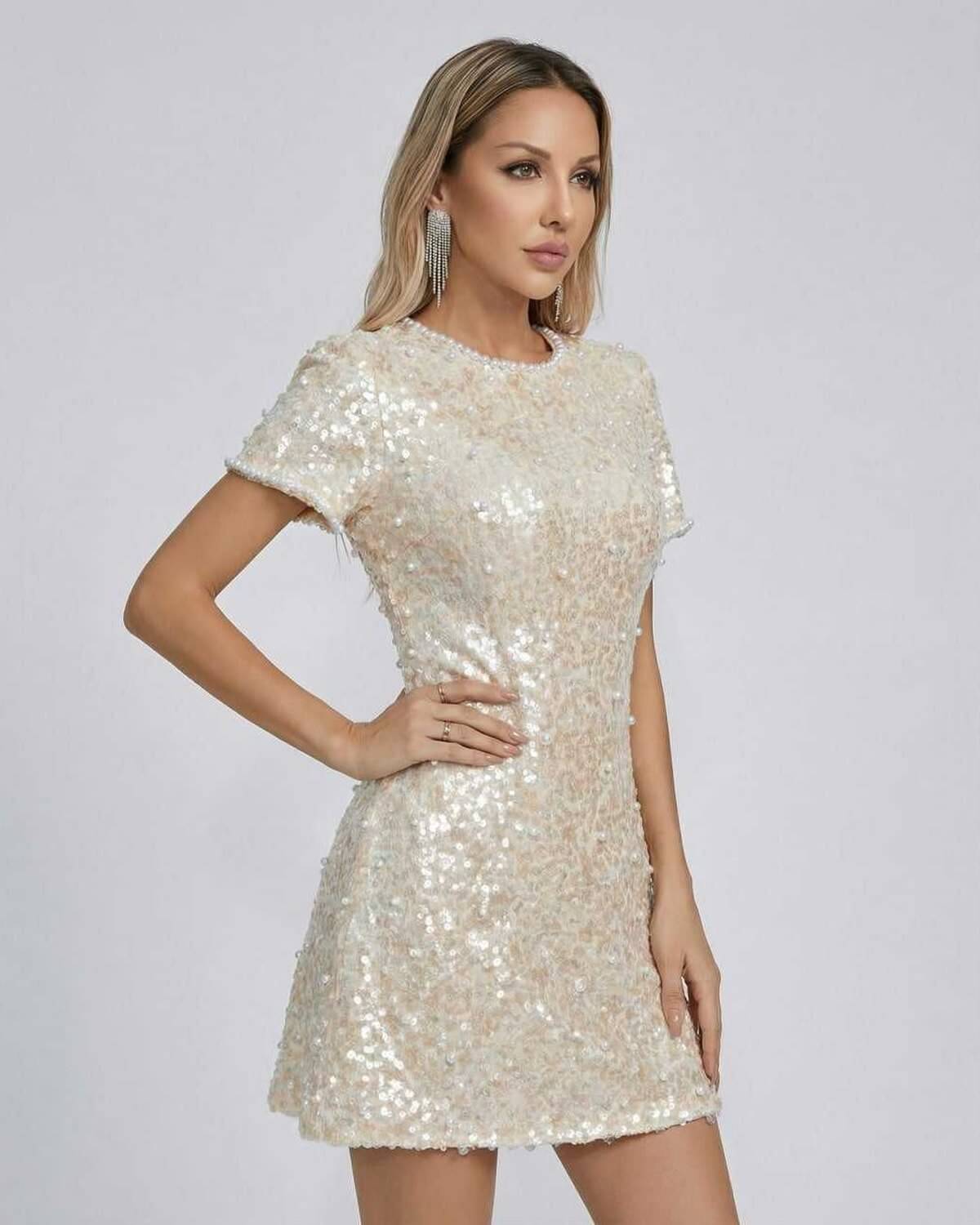 Luna Mini Dress by Lauven featuring elegant sequin embellishments in soft beige for a luxurious and sophisticated look.