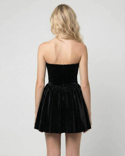 Back view of the Aurora Mini Dress by Lauven, showing a strapless black velvet design with a flared skirt.