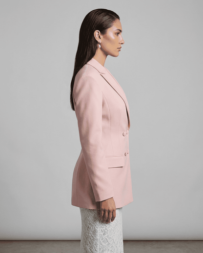 Rosalie Blazer by SLIMONA in pink, showcasing a tailored silhouette and double-breasted design from the side view.