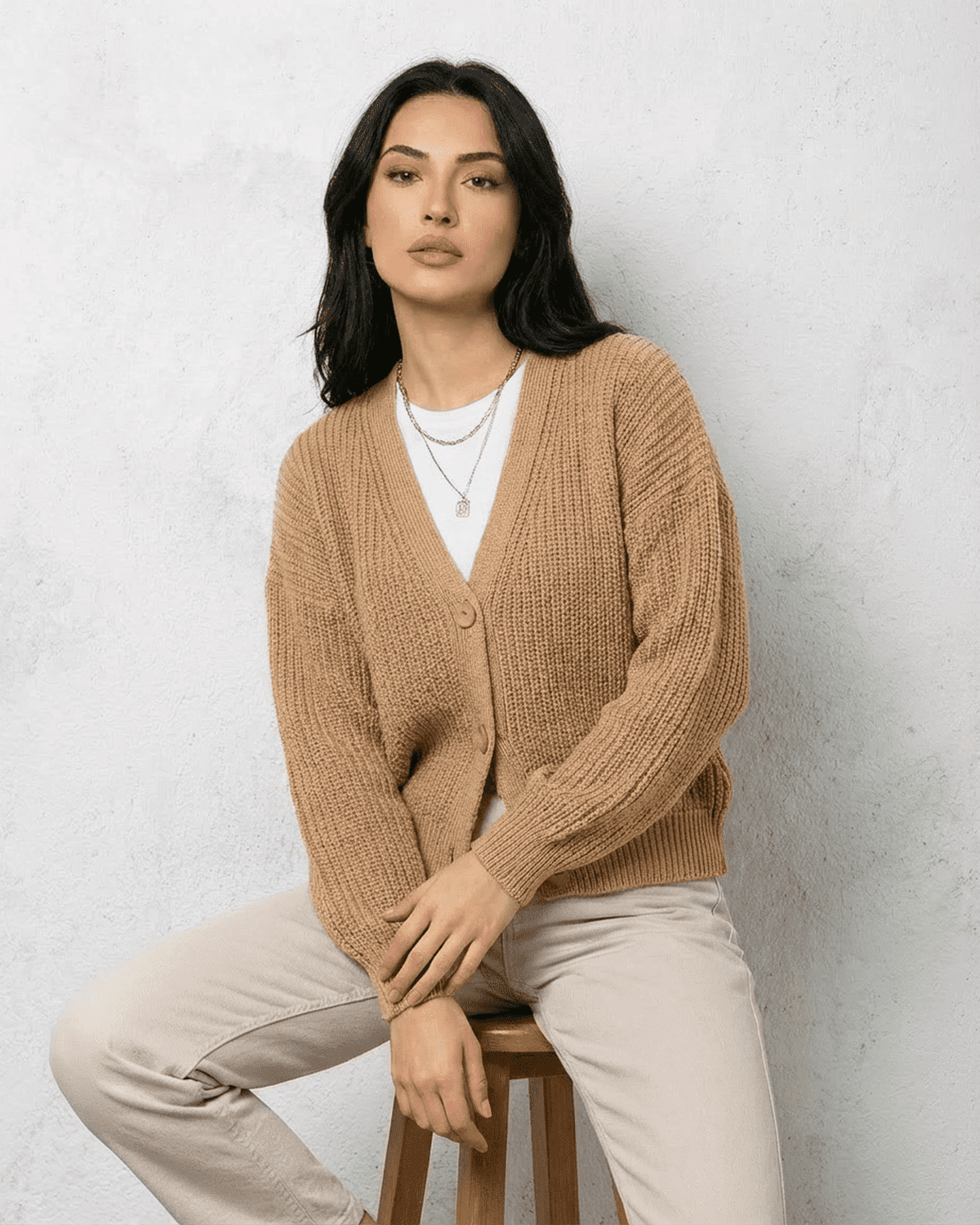 Saffron Cardigan by SLIMONA – Elegant beige knitwear with relaxed V-neck silhouette and long sleeves.