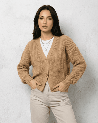 Saffron Cardigan by SLIMONA - Elegant beige knitwear with relaxed V-neck silhouette and button closure.