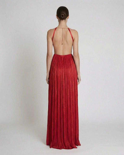 Back view of the Saffron Maxi Dress by Lauven featuring pleated texture and halter neckline in vibrant red.