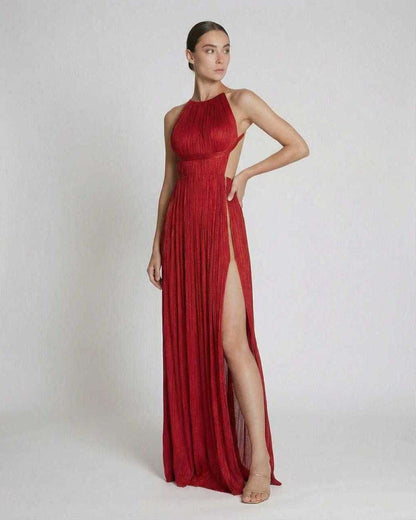 Saffron Maxi Dress by Lauven featuring pleated sheath silhouette and vibrant red halter neckline.
