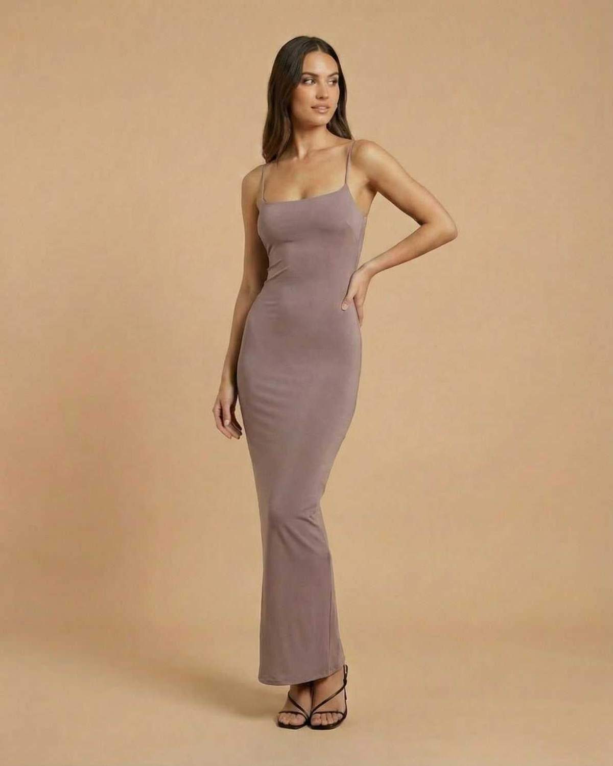 Sahara Maxi Dress by SLIMONA, featuring a taupe color and minimal backless design, ideal for elegant occasions.