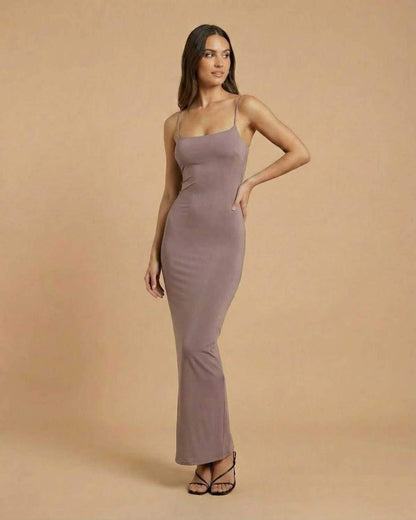 Sahara Maxi Dress by SLIMONA, featuring a taupe color and minimal backless design, ideal for elegant occasions.