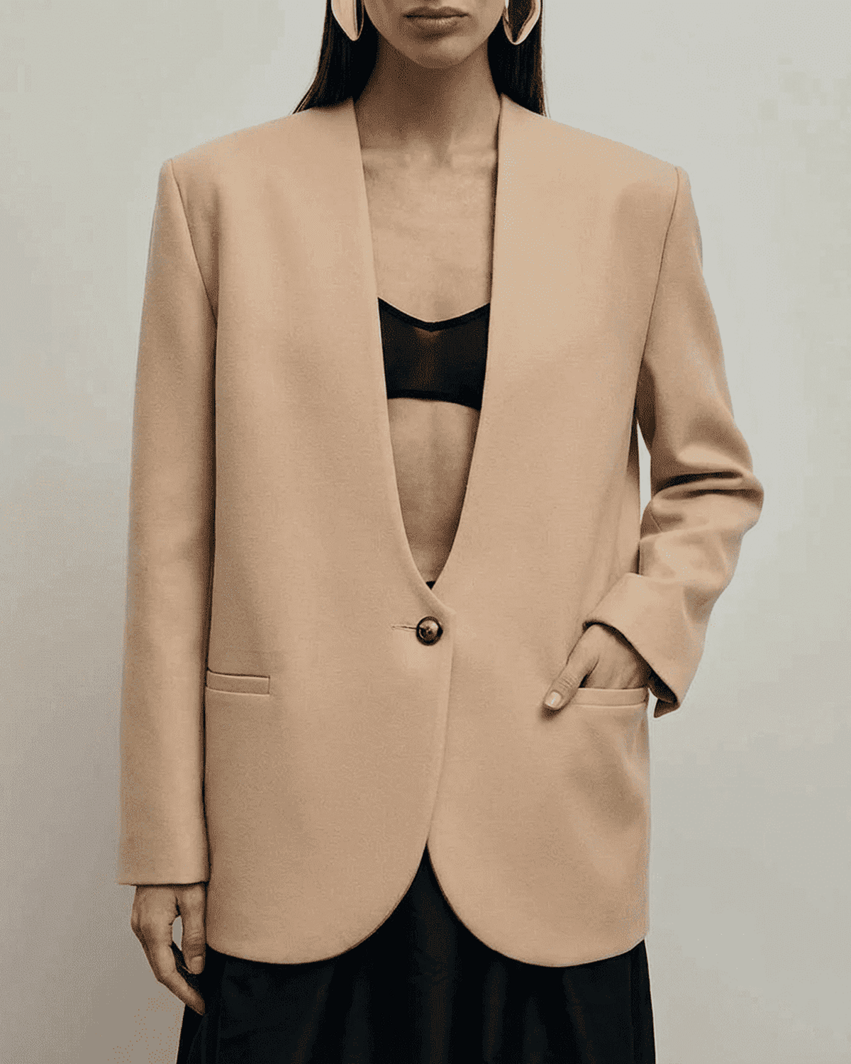 Savona Blazer by SLIMONA in beige, featuring a fitted single-breasted design and deep V-neckline.