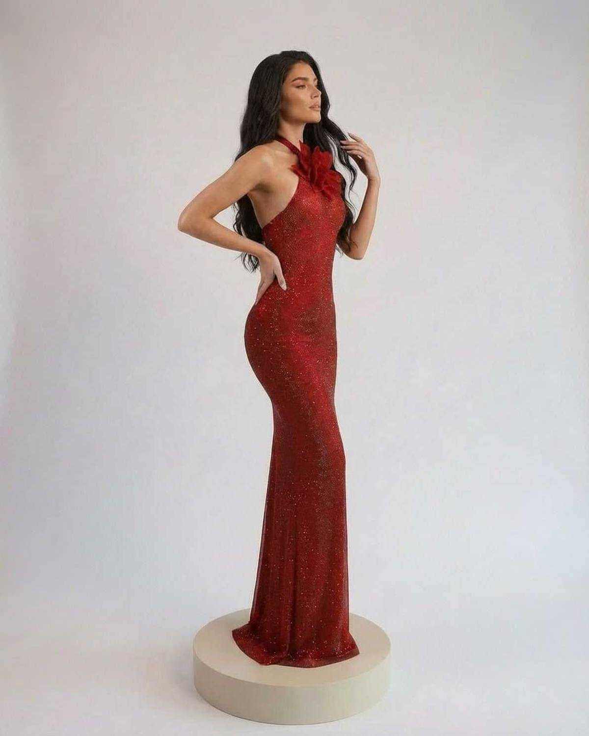 Scarlet Maxi Dress by SLIMONA, featuring a halter neck and floral detail, in a shimmering red color.