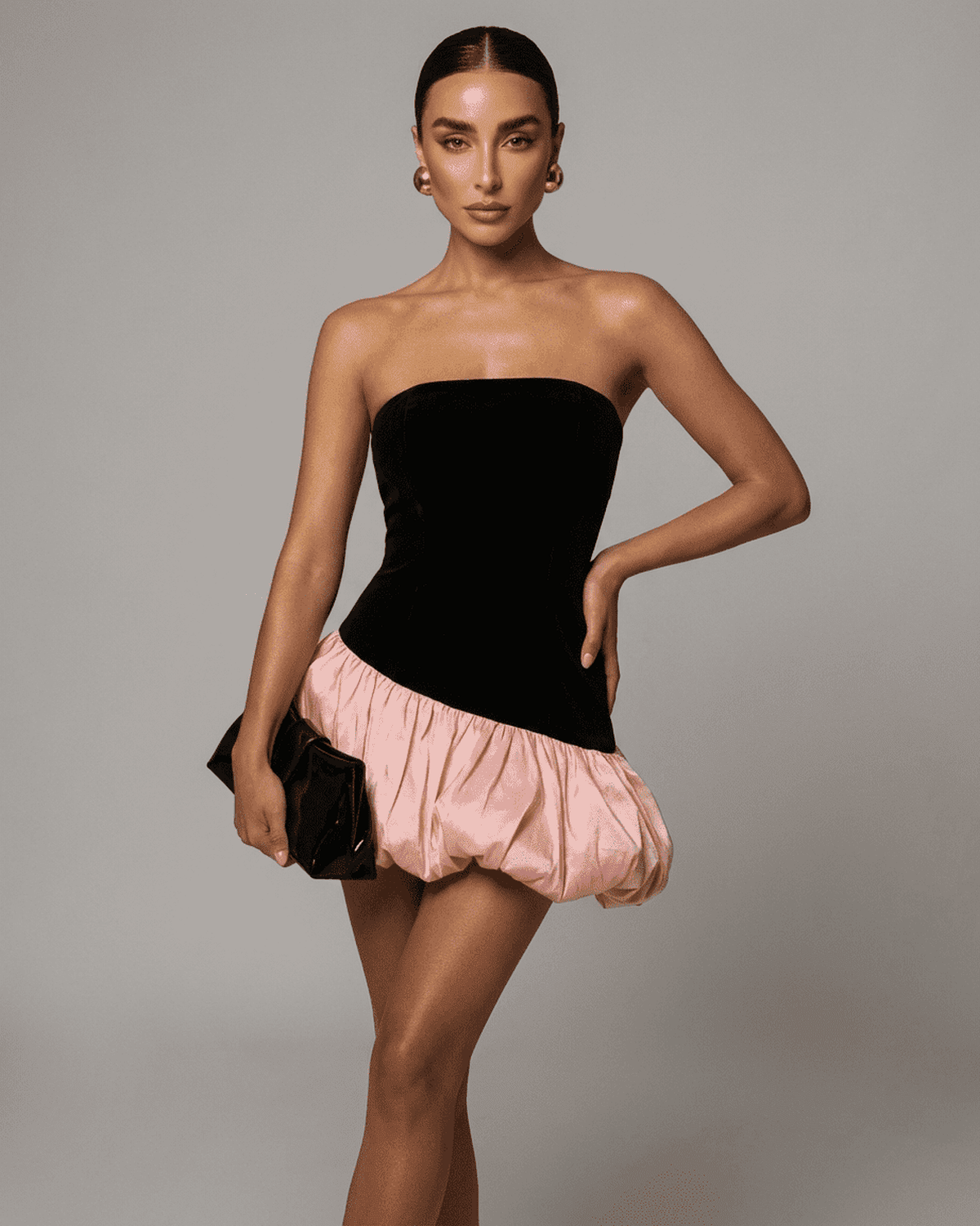 Selina Mini Dress by SLIMONA featuring a strapless black velvet and pink puff skirt, perfect for bold fashion statements.
