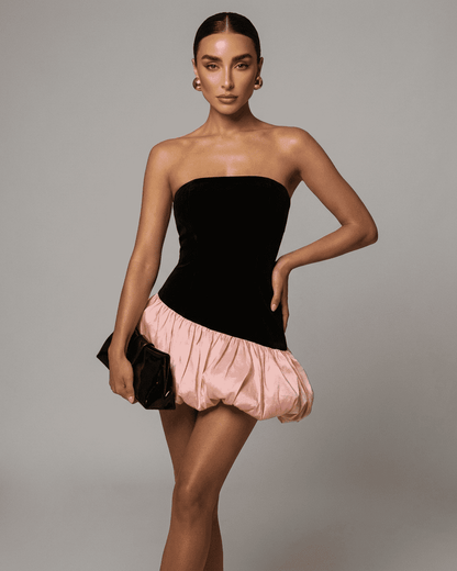 Selina Mini Dress by SLIMONA featuring a strapless black velvet and pink puff skirt, perfect for bold fashion statements.