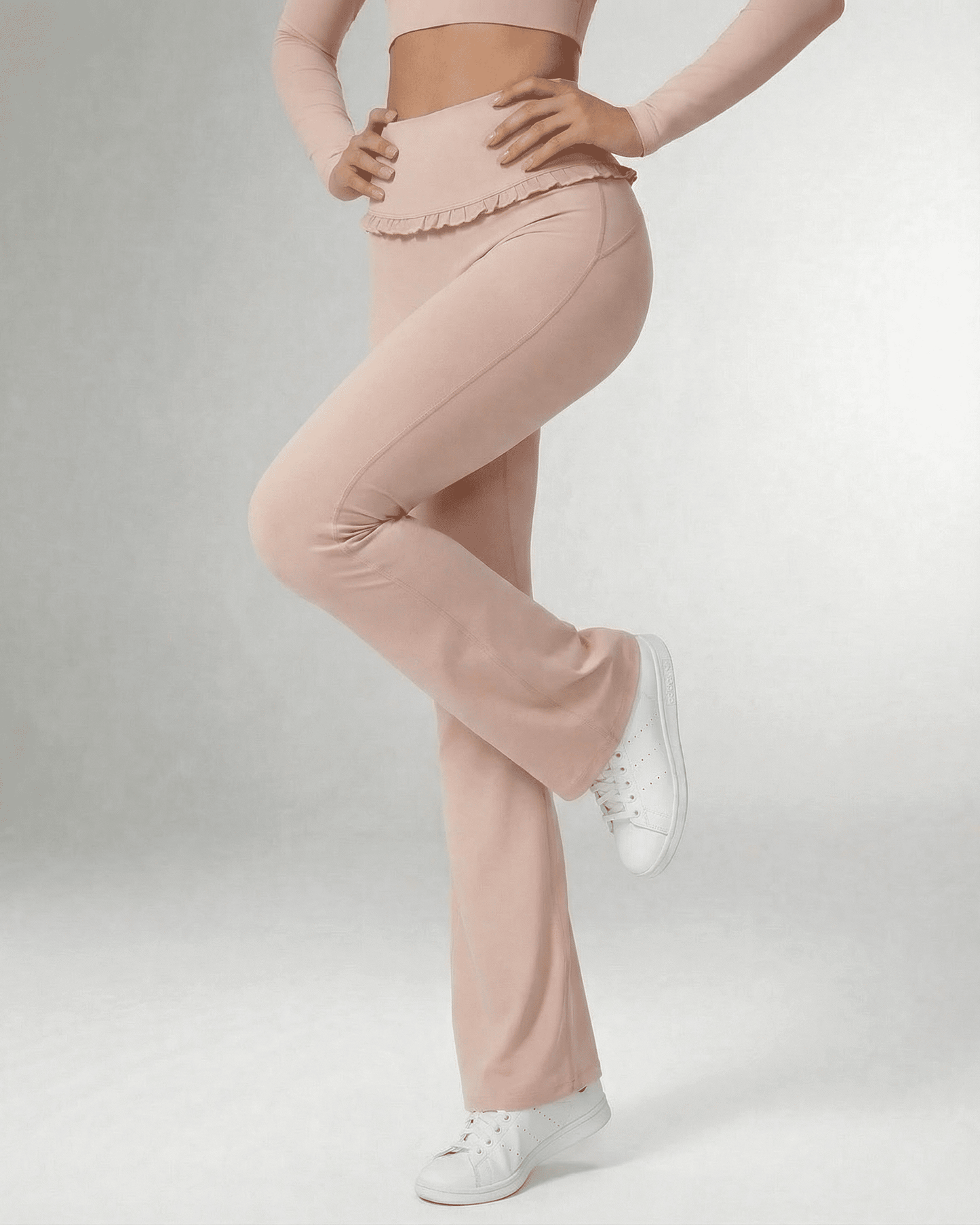 Serena Leggings by SLIMONA - Elegant flare pants in soft pink with pockets and stylish ruffled waistband.