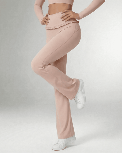 Serena Leggings by SLIMONA - Elegant flare pants in soft pink with pockets and stylish ruffled waistband.