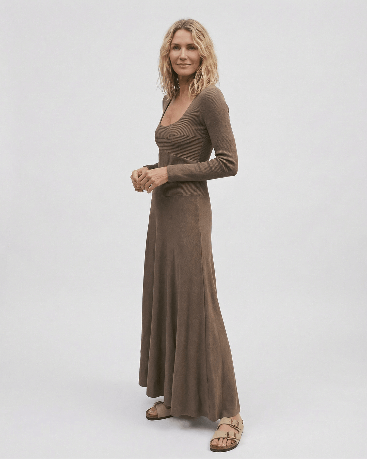 Lauven Siena Maxi Dress in a rich brown tone, featuring long sleeves and a pleated skirt for elegant style.