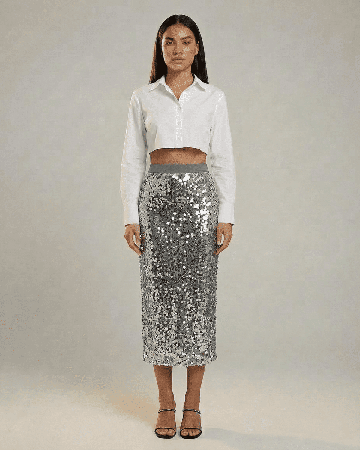 Silvara Midi Skirt by SLIMONA showcased with a chic white crop shirt, featuring sparkling sequins for evening elegance.