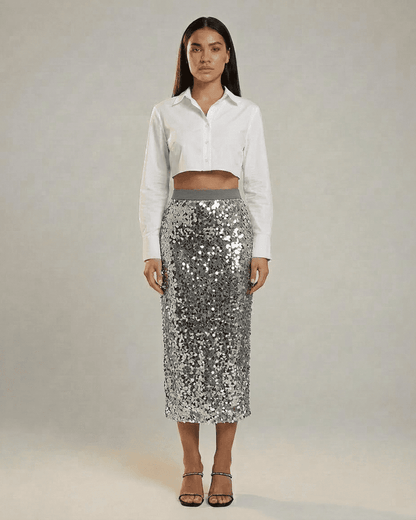 Silvara Midi Skirt by SLIMONA showcased with a chic white crop shirt, featuring sparkling sequins for evening elegance.