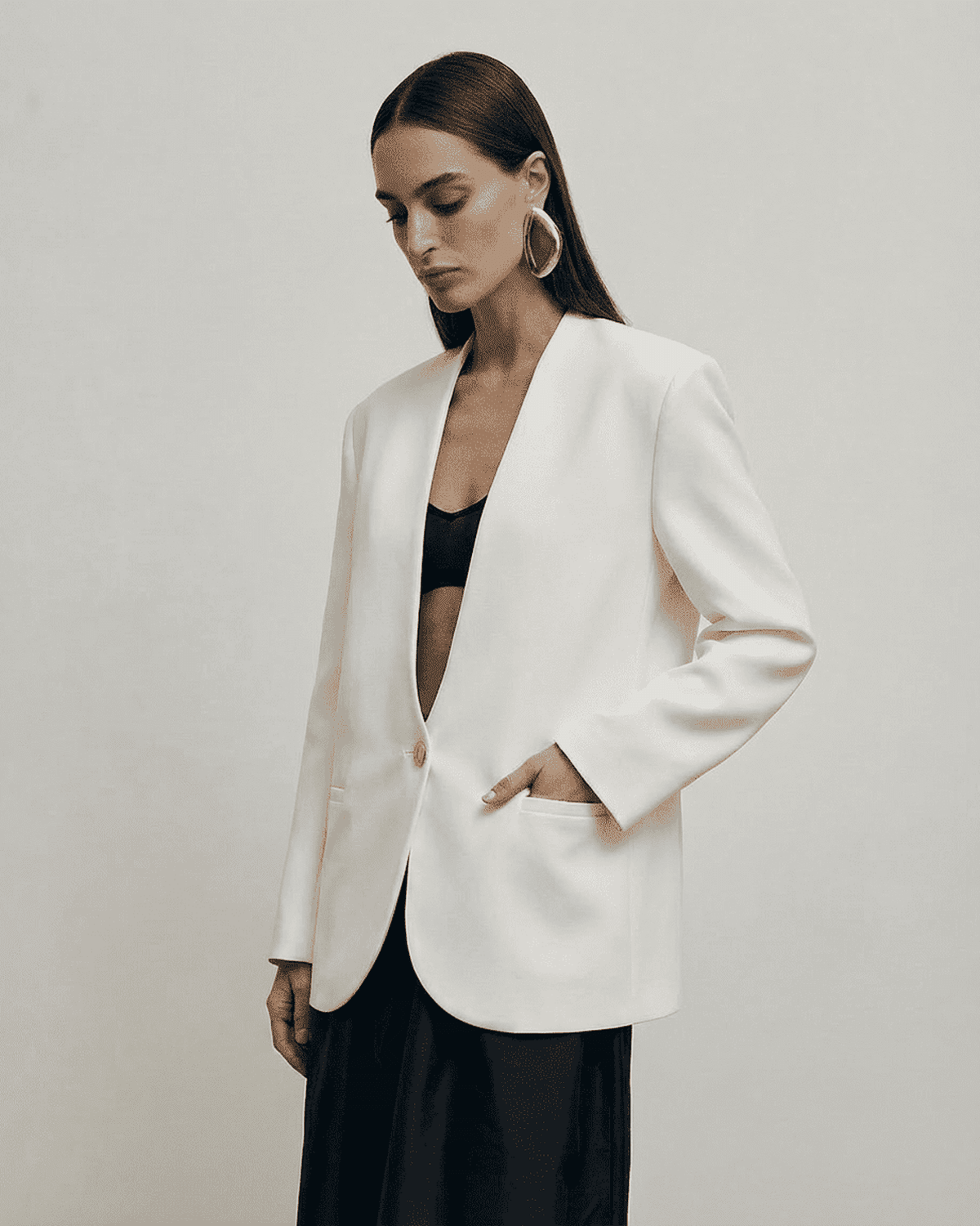 Alba Blazer by SLIMONA, fitted women's blazer with a deep V-neckline and structured shoulders.