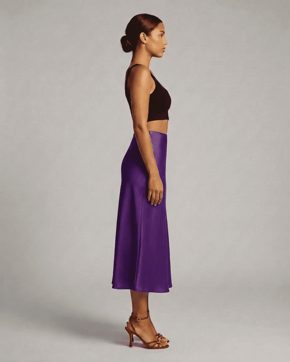 Amethyst Midi Skirt by SLIMONA, showcasing elegant satin mermaid design in vibrant purple color.